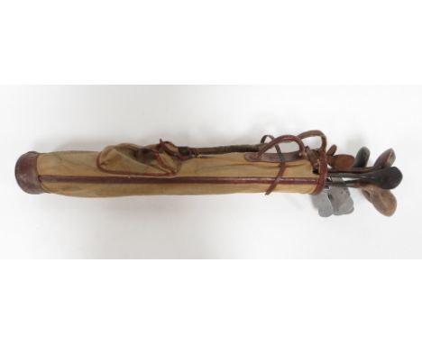A collection of vintage golf clubs