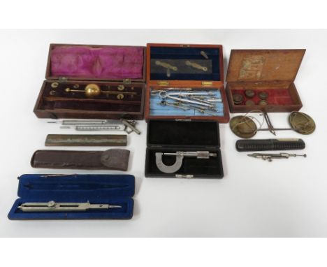 A collection of scientific instruments including weighing scales and other items