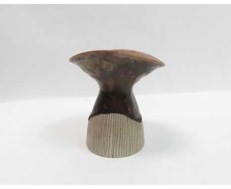 Dame Lucie Rie (1902 -1995) - A pottery vase in a brown and cream glaze, of flared form, 8.5cm