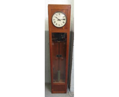 A Magneta electric master clock, with a cream dial, in an oak case, 160cm high