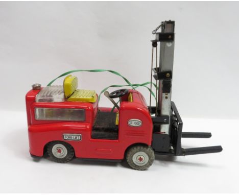 A vintage Japanese battery powered Fork Lift truck boxed