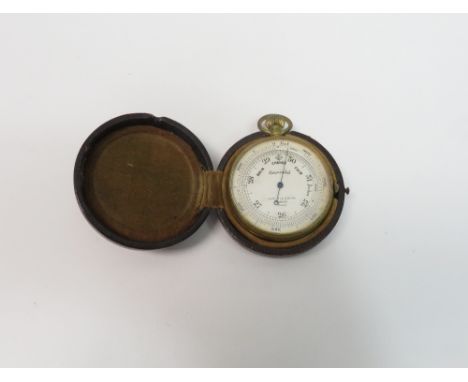 An early 20th century Negretti &amp; Zambra pocket barometer, in a fitted leather case