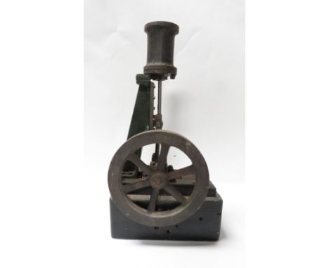 A vertical upright steam engine on a wooden base, 38cm high