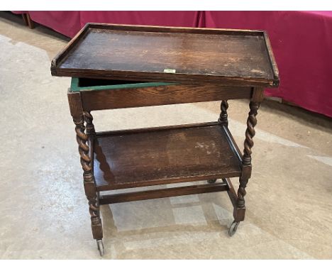 An oak barleytwist two tier serving trolley and card table, the fold-over top with green baize surface. 30' wide