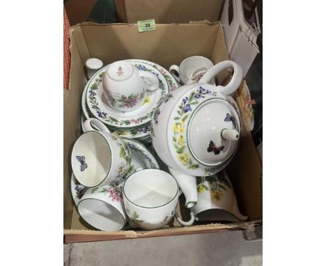 A box of Royal Worcester Herbs pattern teaware