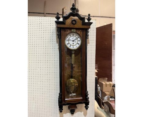 A late 19th century Vienna regulator timepiece in walnut and ebonised case with single train movement and two-piece enamel di