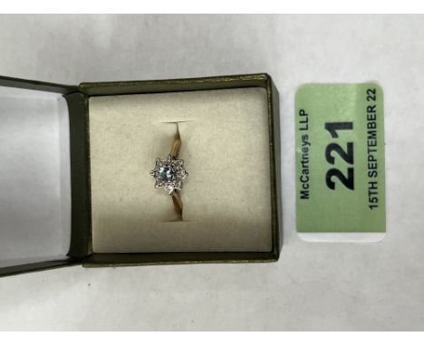 A 9ct aquamarine and diamond cluster ring. 1.6g gross. Size K½
