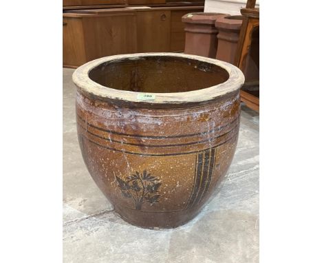 A glazed earthenware planter. 18' diam x 17' high