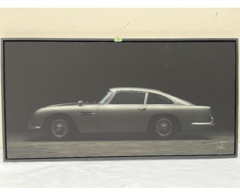 CHRISTIAN SCHWETZ. BRITISH 1967-2022 An Aston Martin DB5. Photographic print on board 23' x 46½'. Prov: The artist's studio