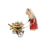 Blech-Figur, Oma mit Karre und Gans, uralt, HL, Uhrwerk def., 1 Flügel fehlt, mit Stimme, kleine LS,