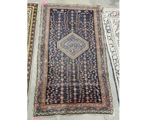 Eastern midnight blue rug&nbsp;with central hooked lozenge on geometric ladder pattern field, multiple geometric borders (som