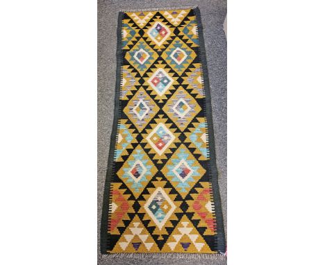 Maimana Kilim black ground runner with one row of four hooked lozenges and two rows of three lozenges 190cm x 70cm