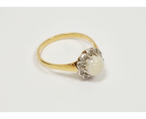 18ct yellow gold opal and diamond cluster ring, the round claw-set cabochon white opal set in a flower shaped head with 10 il