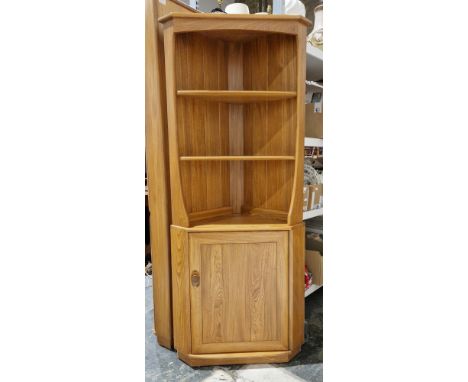 Ercol Windsor elm corner cabinet&nbsp;model 743C with two fixed shelves above a single cupboard door, 179cm high x 73cm wide 