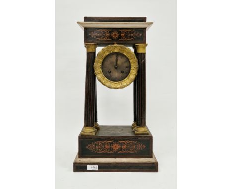 Late 19th/early 20th century stained wooden pillar clock, the four tapering columns supporting the gilt metal mount, the engi
