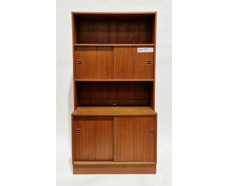 Mid-century Danish Feldballes Mobelfabrik teak wall unit comprising a shelf over two sliding cupboard doors, the base with tw