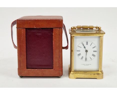 Brass cased carriage clock, the enamel dial with roman numerals, retailers mark 'Kamozzi &amp; Baxter, Bicester', 11cm high, 