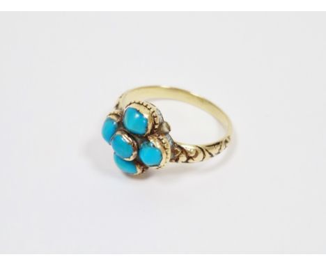 19th century yellow metal and turquoise ring,&nbsp; set with a cluster of five collet set cabochon turquoises surrounded by r