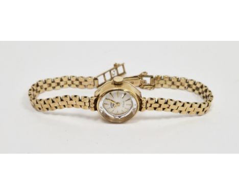 Rotary 21-jewel manual wind ladies wristwatch, the silvered dial with raised gilt baton hour markers, 9ct gold case and link 