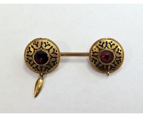 19th century 9ct yellow gold brooch in the Etruscan style, the bar brooch with two black enamel decorated roundels having clo