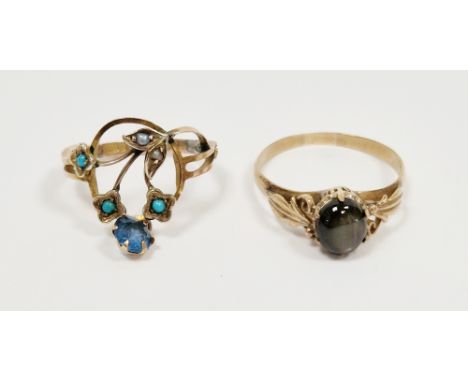 14k yellow gold and black star sapphire ring, the oval cabochon showing asterism, foliate scroll shoulders, size Q 1/2, appro