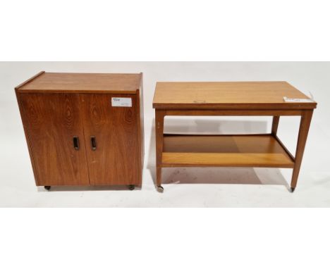 Mid-century teak coffee table/drinks trolley, the rectangular top folding over and swivelling to form a larger square top, ov