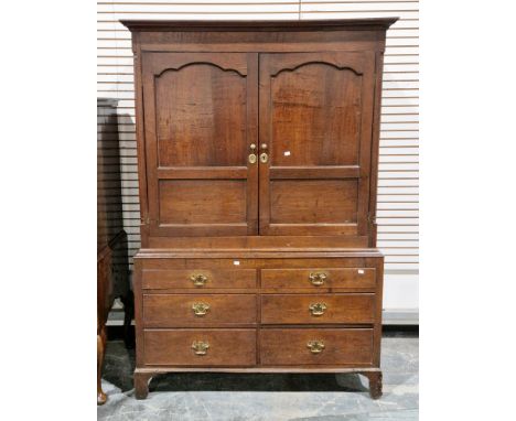 18th century oak housekeeper's cupboard, the upper section with moulded cornice over two moulded panel doors, opening to a ha