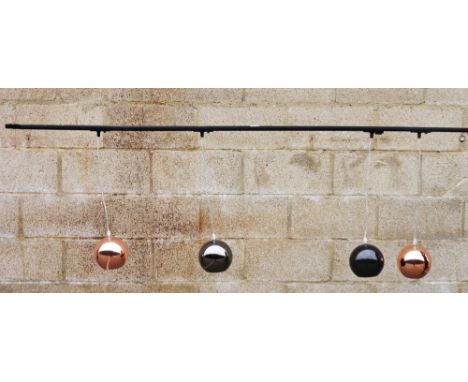 Ceiling channel light fitting&nbsp;with four adjustable lights, two with a copper finish globular shade and two with a black 