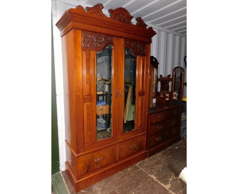 A Victorian walnut double wardrobe and dressing chest, by Blair and Kemp, Horncastle, the wardrobe with outswept pediment ove