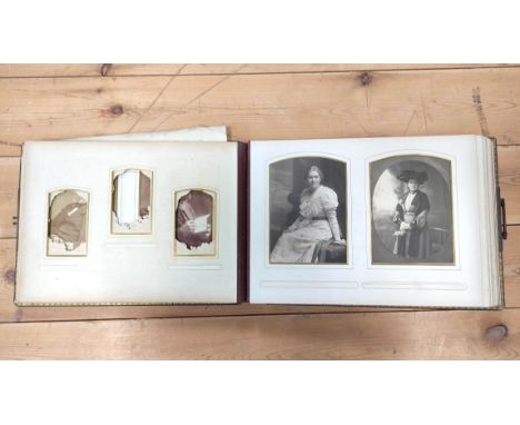 Photographs.&nbsp;Victorian dark morocco oblong album with clasp (defective spine), dec. card leaves, part filled only with 1