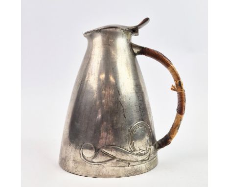 AN ARCHIBALD KNOX FOR LIBERTY AND CO WATER JUG. 'Tudric' pewter. Numbered 0307 to base. 21cm H.