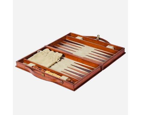 TRAVELLING BACKGAMMON SET. tan leathered case, 7cm H x 40cm W x 23cm D.