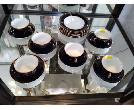 Six Romanov navy blue and gilt teacups, saucers and side plates. (18) 