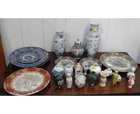 Japanese Ceramic wares including two blue and white baluster vases 26cm and 20cm, seven plates and miniature vases. (25) 