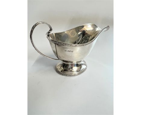 A Sterling Silver Sauce Boat. Sheffield 1993. With beaded reel and bobbin border. 109 grams. 16.6cm long.