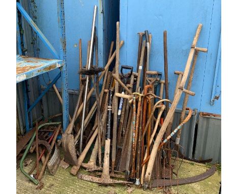 Large quantity of garden tools including pick axes, walking sticks &amp; other items