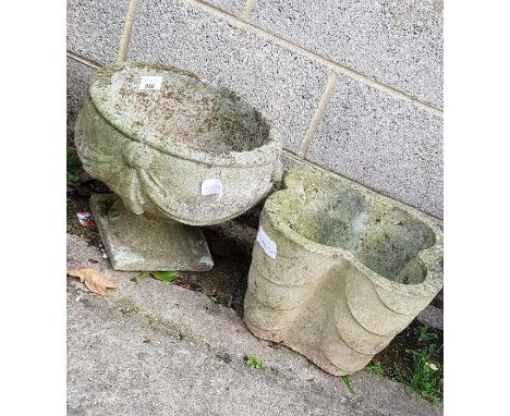 Reconstituted stone urn planter along with another planter