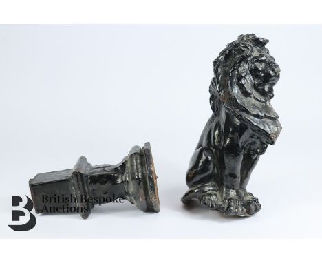 Architectural interest - Cast iron lion statue in two parts. The lion measures approx h 35cms and weighs approx 15.8kgs, the 