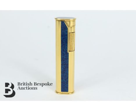 Dunhill slim line lighter, gold plated with enamel, Swiss made, pat no. 3810750, des pat no. 235456 to base, approx 7 cms, in
