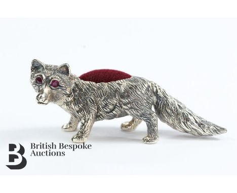 Silver pin cushion, in the form of a fox, having ruby eyes, approx 60 mm, approx 24.78 gms.&nbsp;