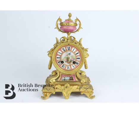A late 19th century French ormolu mantel clock, with Japy Freres (medal winner) movement and pink Sevres porcelain roman nume