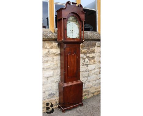 19th century Derbyshire mahogany long case clock. The clock having an enamel painted break arch dial with Roman numerals, wit