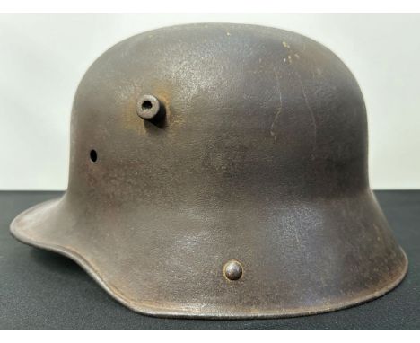 WW1 Imperial German M16 Helmet Shell, no liner or chinstrap. Dent to top from either demilitarization post war or possible ba