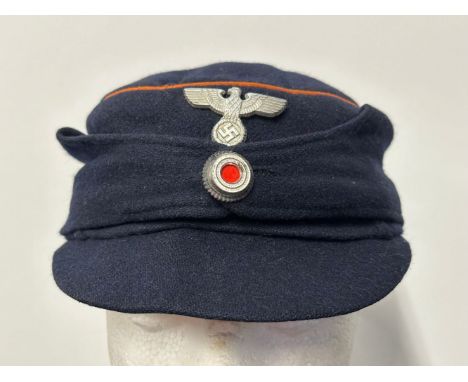 WW2 Third Reich Deutsche Reichspost Baschlikmutzen. Blue wool with orange piping to the crown. Metal DRP eagle and cockade to