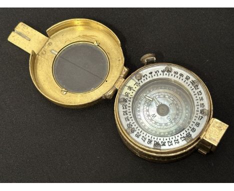 WW2 British Compass MKIII. Maker marked and dated "TG &amp; Co. Ltd London 1942" along with WD Broad Arrow. Serial number 203