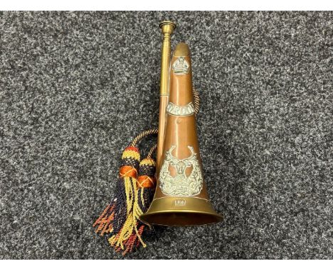 Bugle with Gordon Highlanders cap badge and shoulder title and rank Crown affixed. Along with plaque named "2669 Bugler H Sul