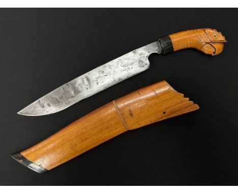 Indonesian Golok with single edged blade 270mm in length. Marked with three stars. Wooden grip in the form of a birds head. O