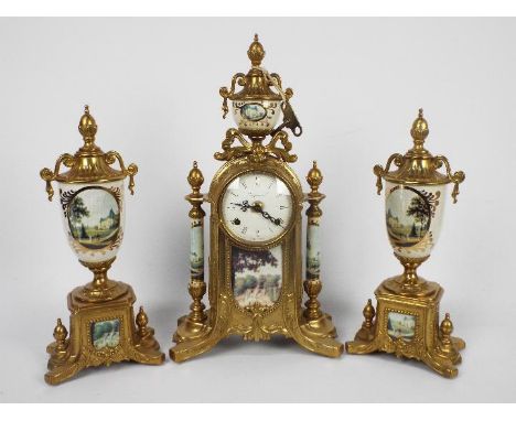 An Italian gilt brass and ceramic clock garniture, signed to the dial Imperial, clock approximately 42 cm (h).