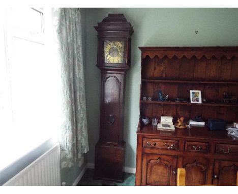 A good early 18th century oak cased longcase clock, signed to the 11 inch brass dial for Waddington (John, sometimes Johannes