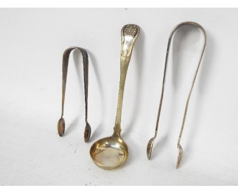 A William IV silver ladle, Edinburgh assay 1835, sponsors mark for Andrew Wilkie and two pairs of sugar tongs, Birmingham and